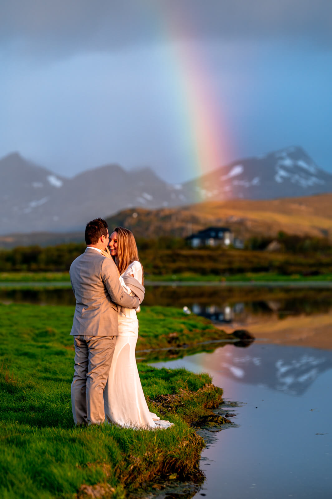Elopement at Lofoten islands under midnight rainbow