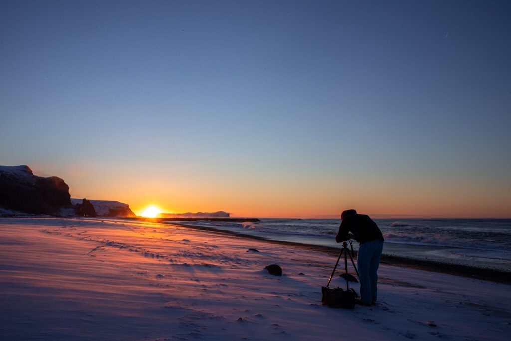 Elopement photographer Jarda Zaoral during sunrise at Arctic beach in Iceland