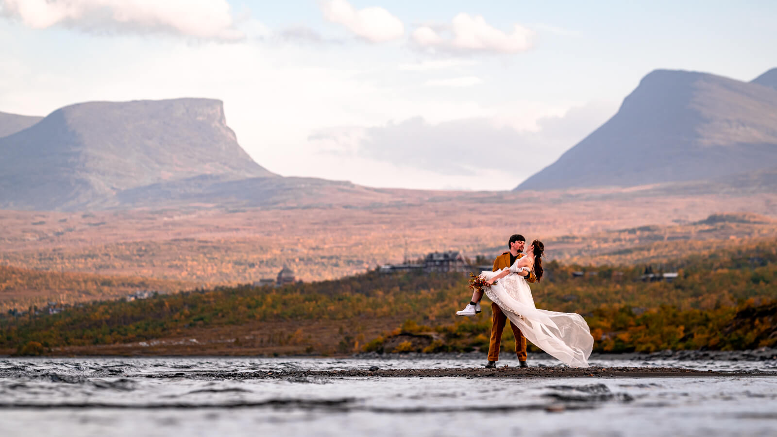 Freshly married couple in Abisko national park in front of Lappland gate