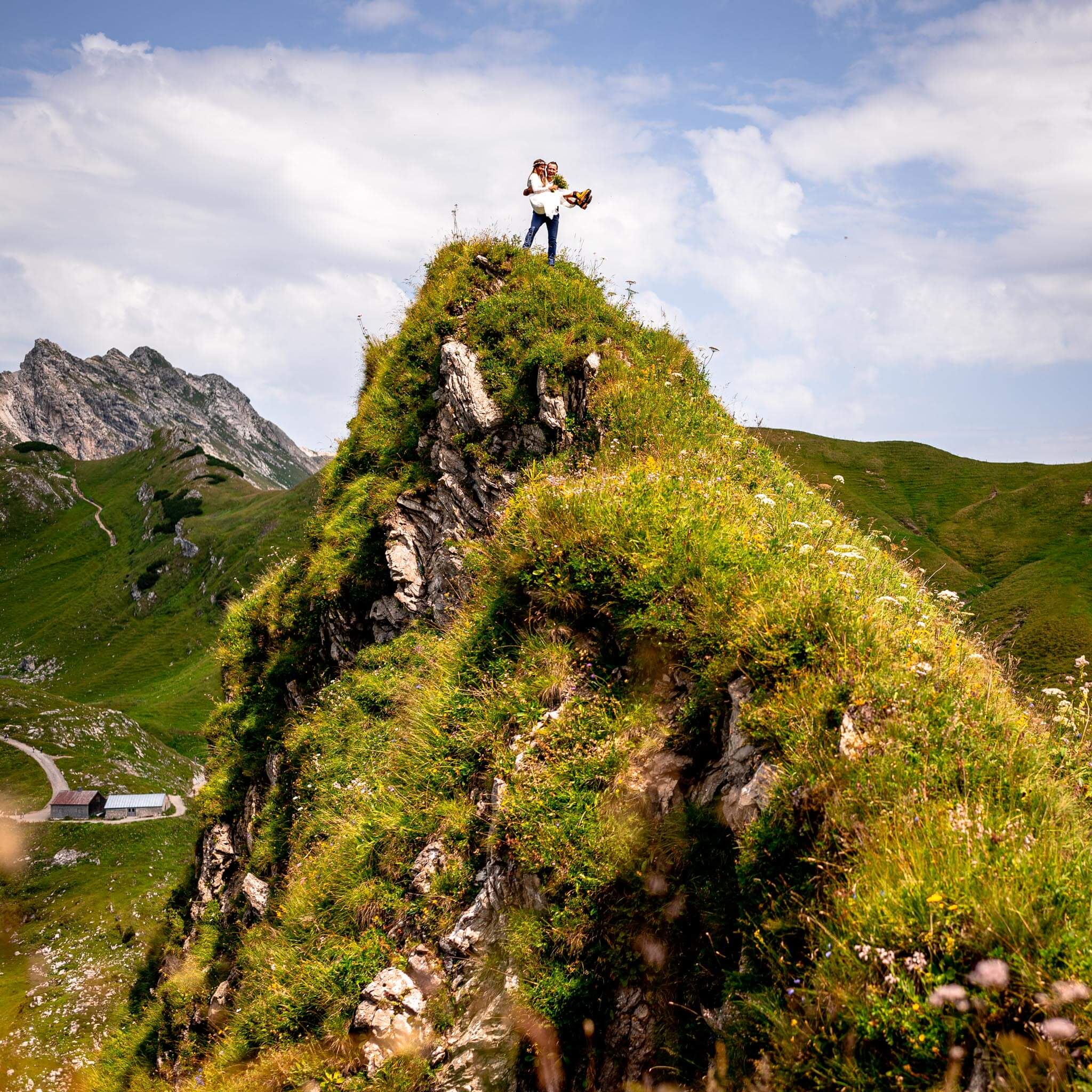 Happy couple enjoying elopement on a mountain top in German Alps